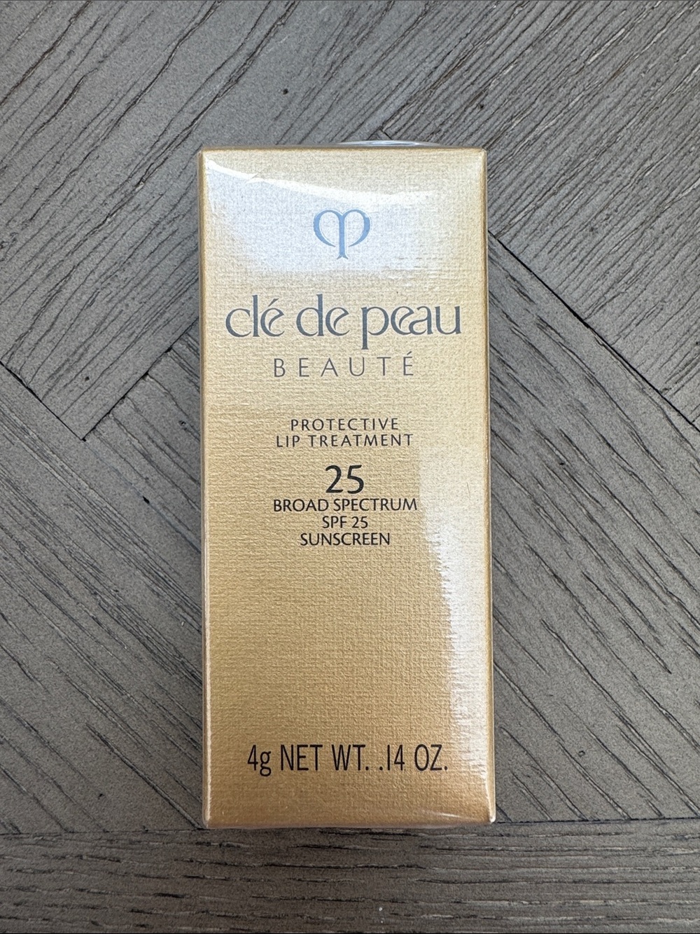 clé de peau Beauté Protective Lip Treatment SPF 25 — gold